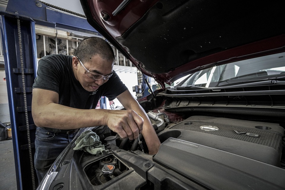 Man doing DIY on car